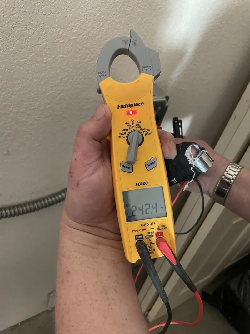 Voltage testing with clamp meter during Electrical Installation Services in Coal Valley